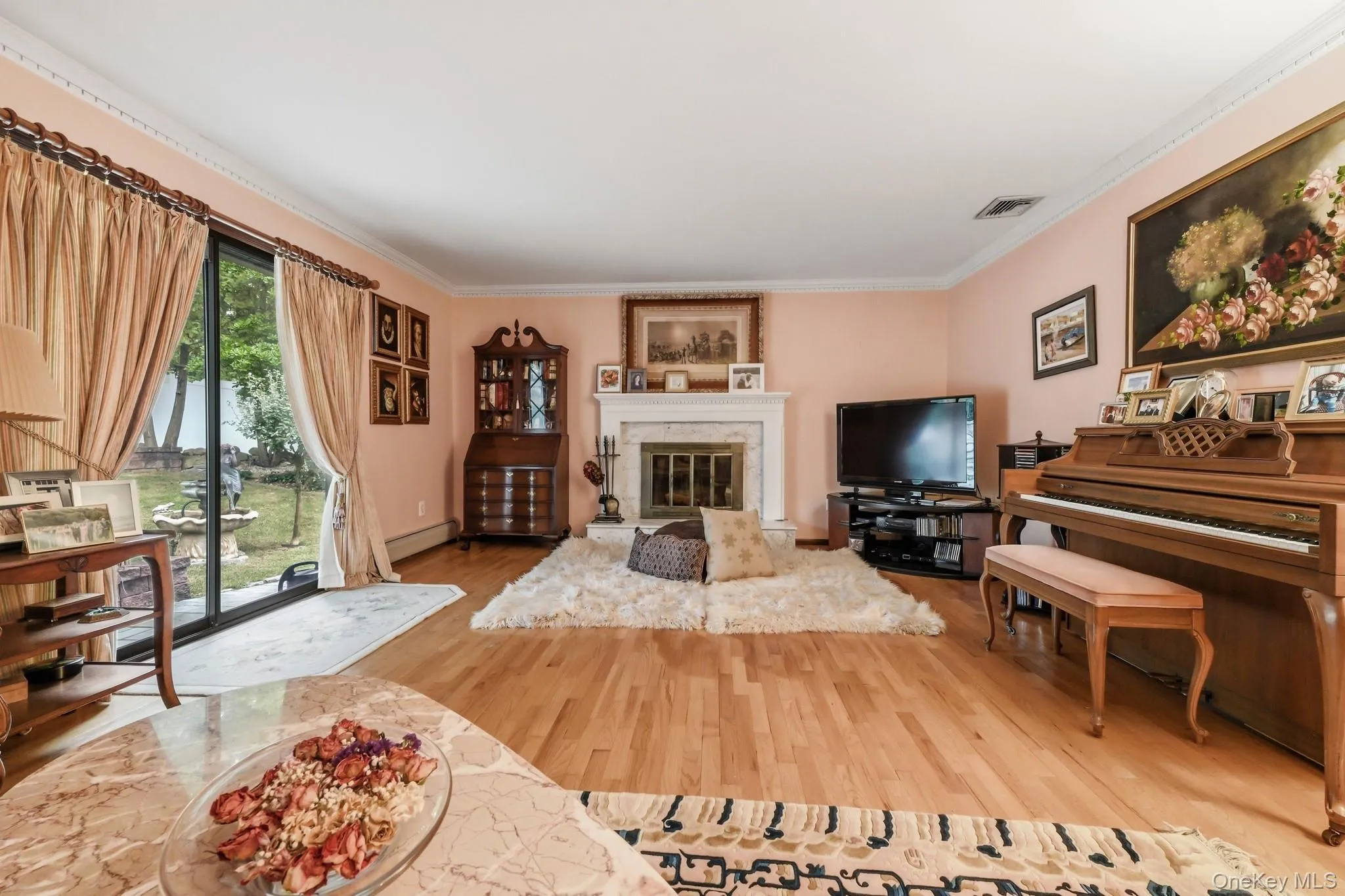 Oversized sliders and marble surround fireplace Oversized sliders and marble surround fireplace
