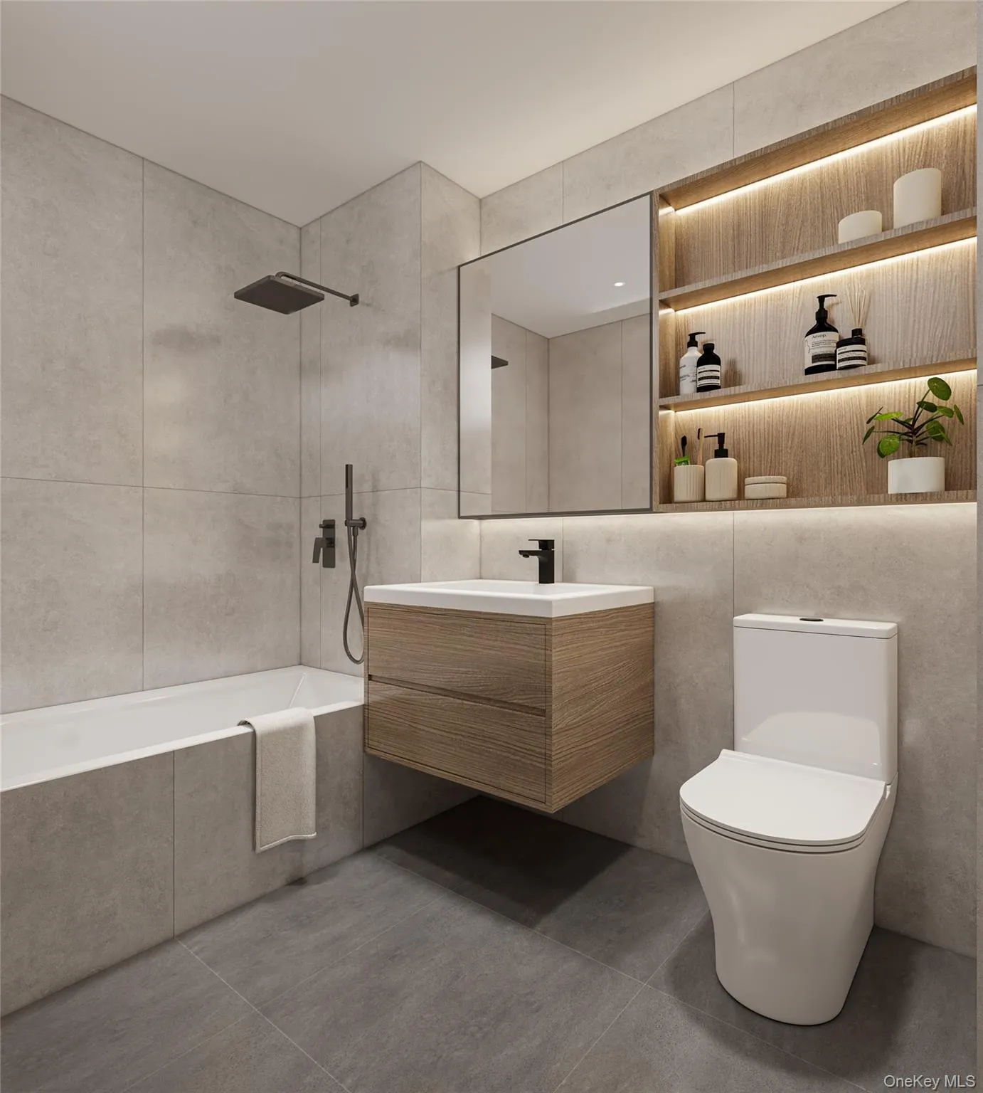 Bathroom featuring vanity, tiled shower / bath, and tile walls Bathroom featuring vanity, tiled shower / bath, and tile walls