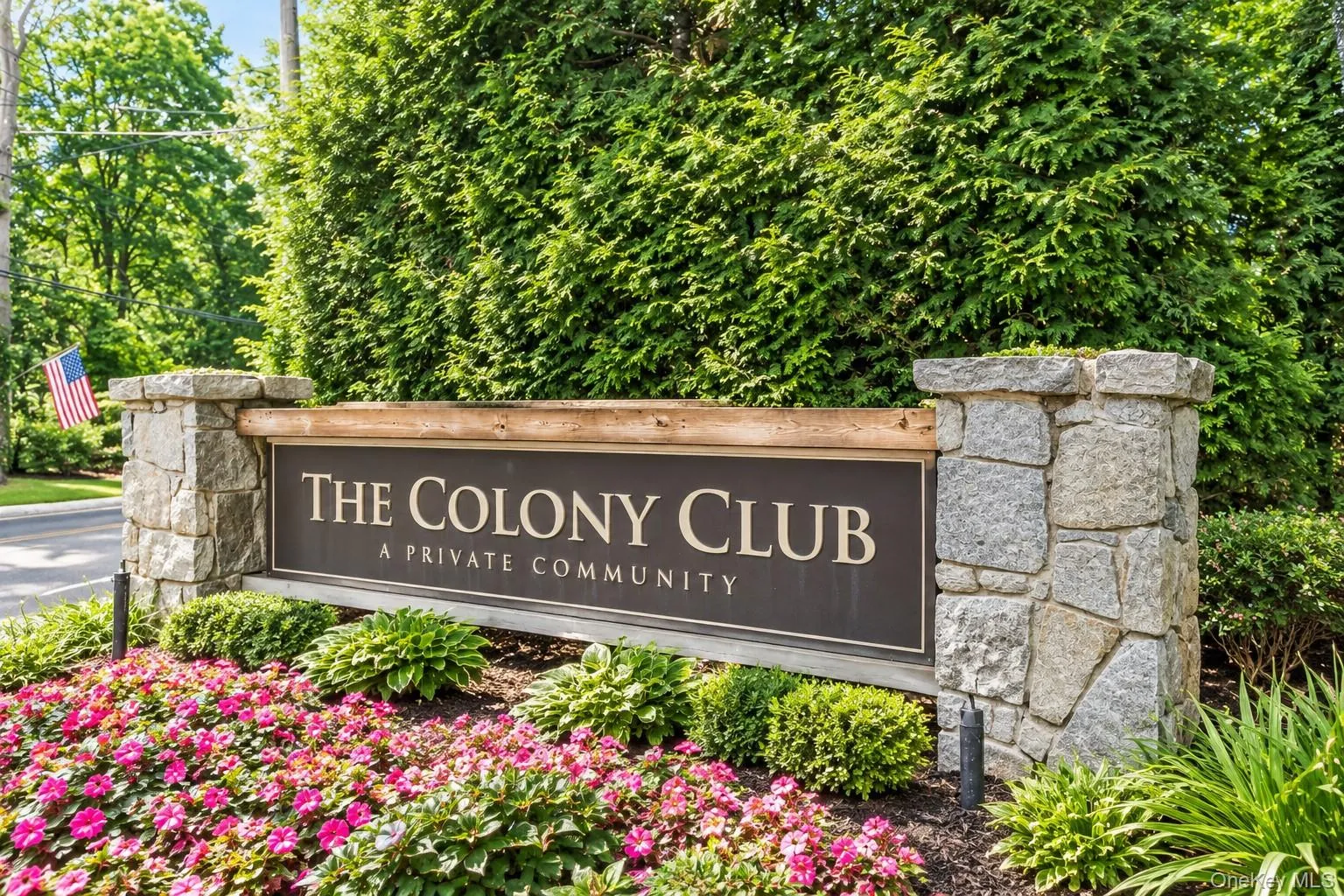 Virtually Edited. Stone pillar entrance sign for "The Colony Club" featuring integrated lighting and natural landscaping. Virtually Edited. Stone pillar entrance sign for "The Colony Club" featuring integrated lighting and natural landscaping.
