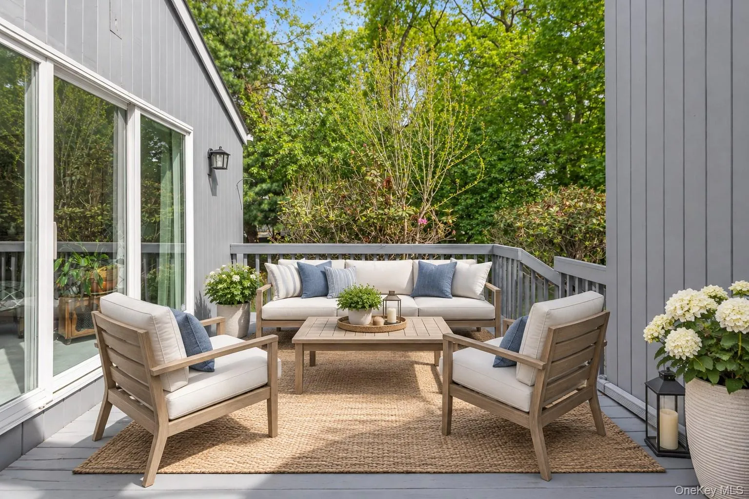 Virtually Staged Deck. Expansive grey painted wood deck featuring a railing system. Virtually Staged Deck. Expansive grey painted wood deck featuring a railing system.