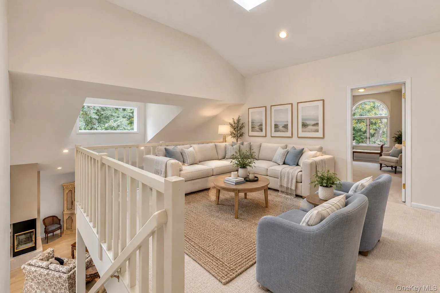 Virtually Staged Open loft space featuring a skylight, recessed lighting, wood railing, and a carpeting flooring overlooking lower level. Virtually Staged Open loft space featuring a skylight, recessed lighting, wood railing, and a carpeting flooring overlooking lower level.