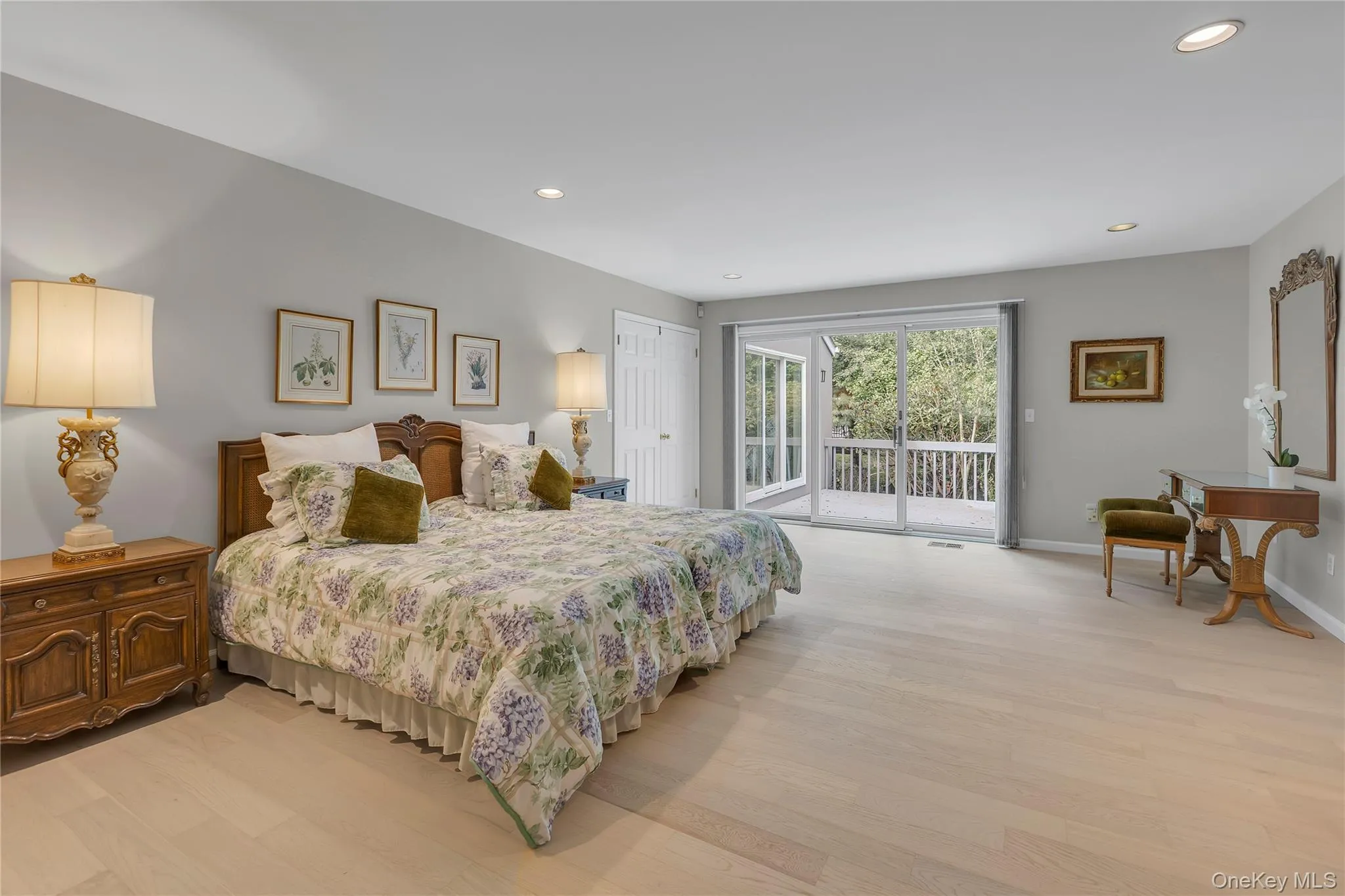 Light-filled room featuring a brand-new plush carpeting, recessed lighting, and a sliding glass door opening to an outdoor deck. Light-filled room featuring a brand-new plush carpeting, recessed lighting, and a sliding glass door opening to an outdoor deck.