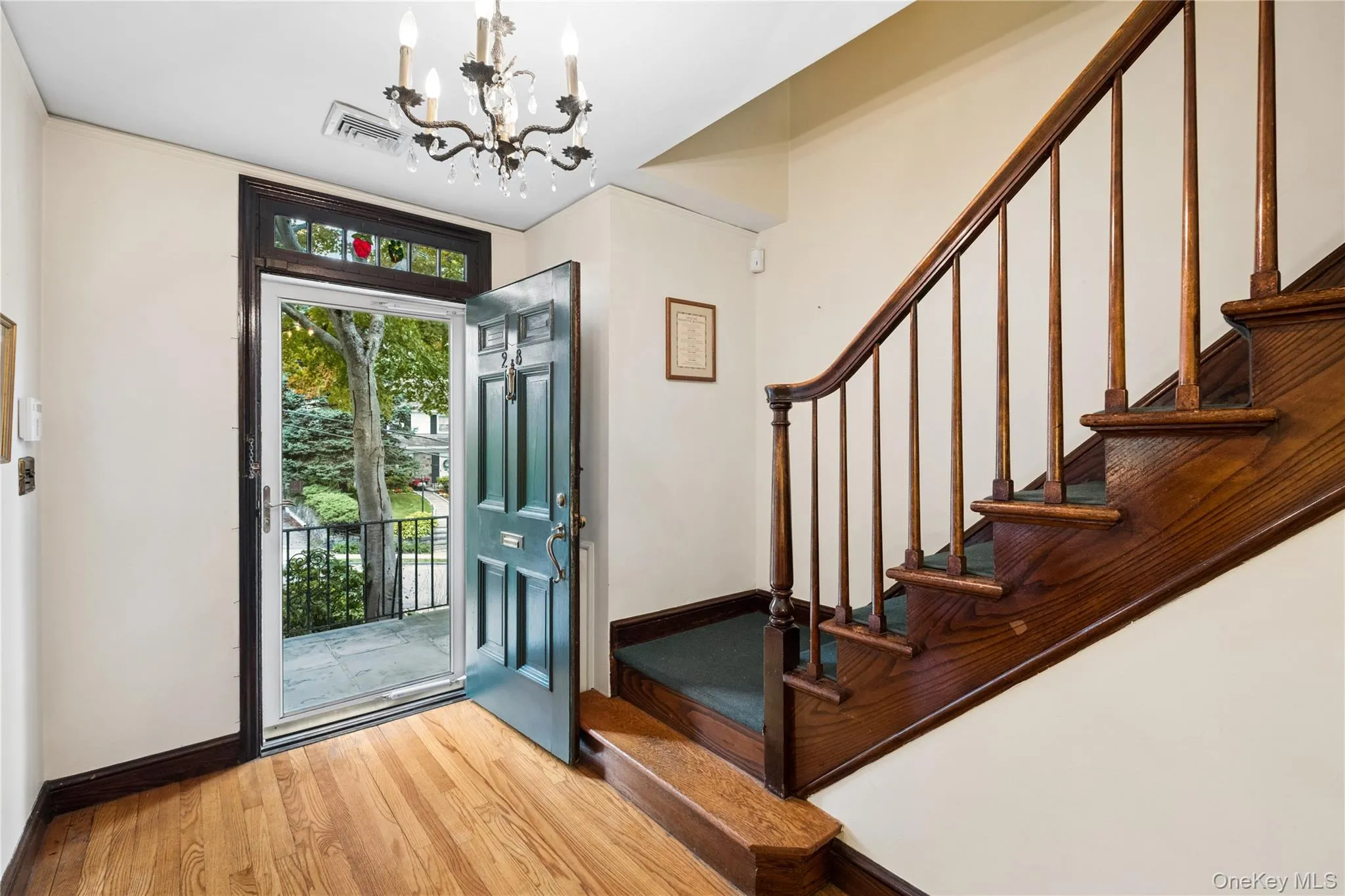 Front door has blue stone patio at the entrance. Front door has blue stone patio at the entrance.