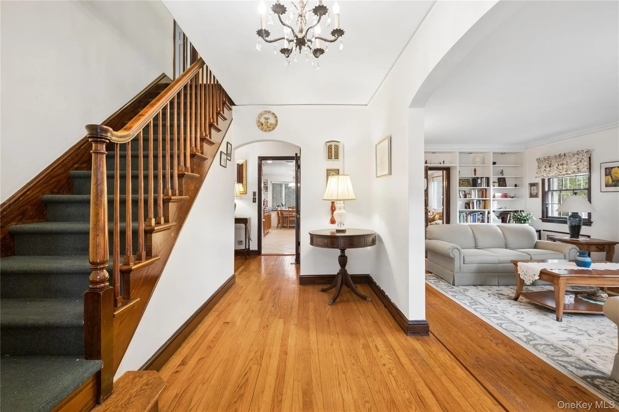 Large entry foyer w/ view of the stairs to 2nd floor and inviting living room Large entry foyer w/ view of the stairs to 2nd floor and inviting living room