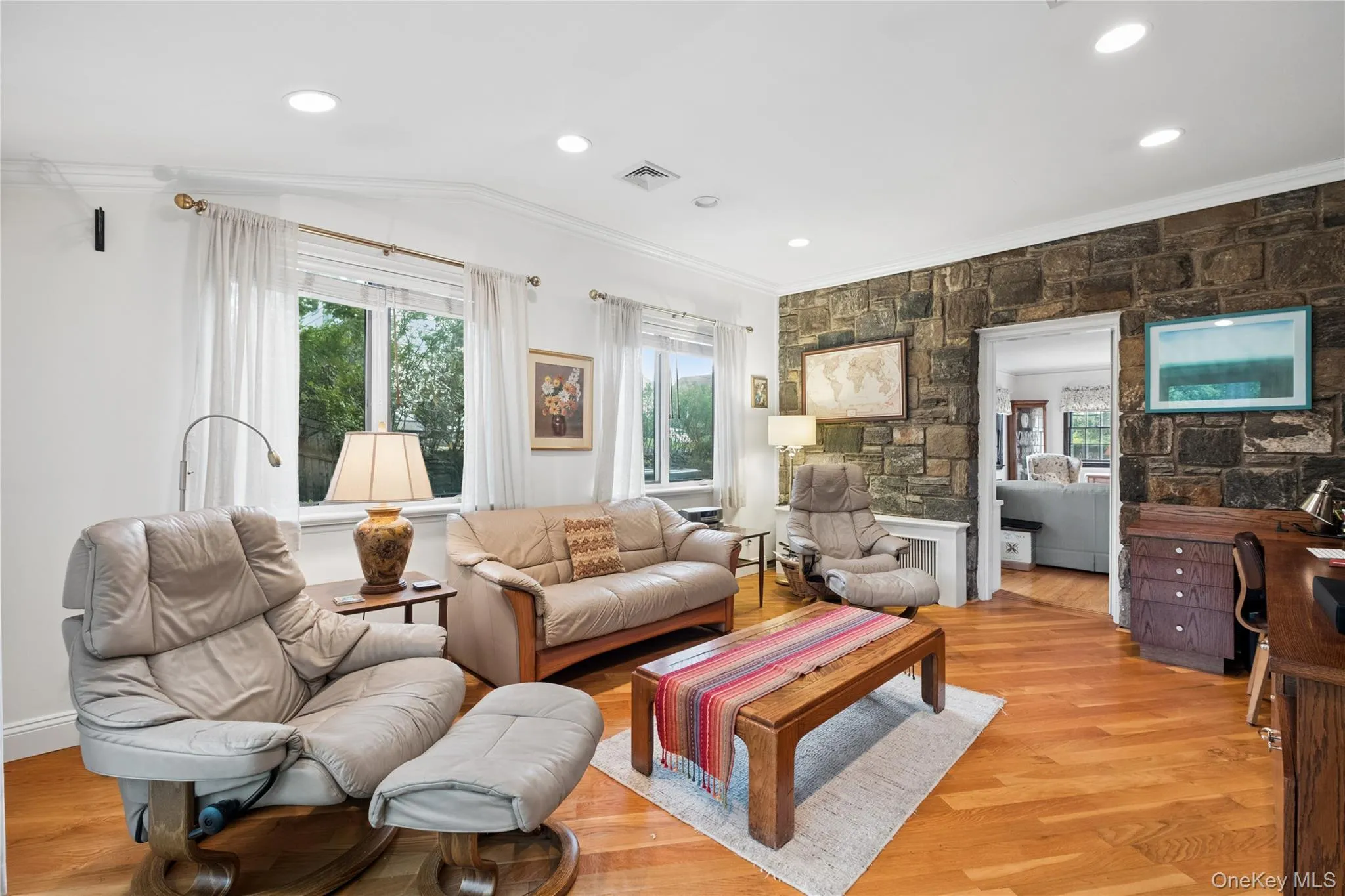 Family Room with Stone Accent Walls and wood flooring Family Room with Stone Accent Walls and wood flooring