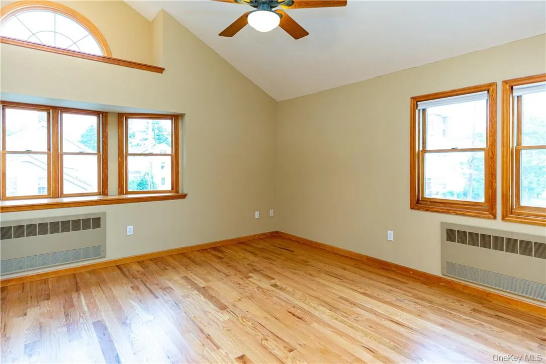 ...the primary bedroom, with a vaulted ceiling. ...the primary bedroom, with a vaulted ceiling.