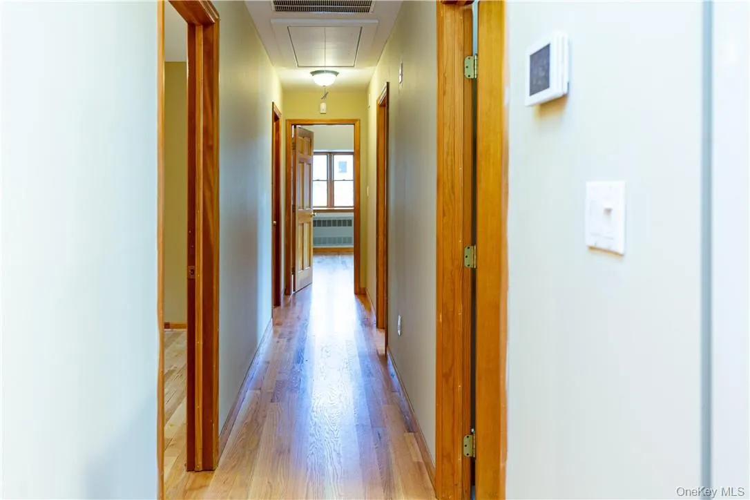 At the end of the great room is a long hallway which leads to... At the end of the great room is a long hallway which leads to...