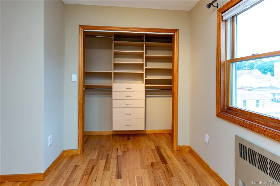 Closet with custom shelving in third bedroom. Closet with custom shelving in third bedroom.