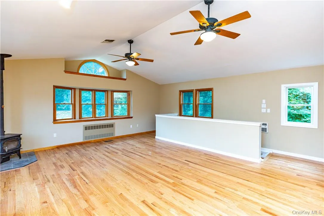 Truly a bright and airy space with a half round arch window above the bay window, multiple sets of track lights, cathedral ceiling, two ceiling fans and central air. Truly a bright and airy space with a half round arch window above the bay window, multiple sets of track lights, cathedral ceiling, two ceiling fans and central air.