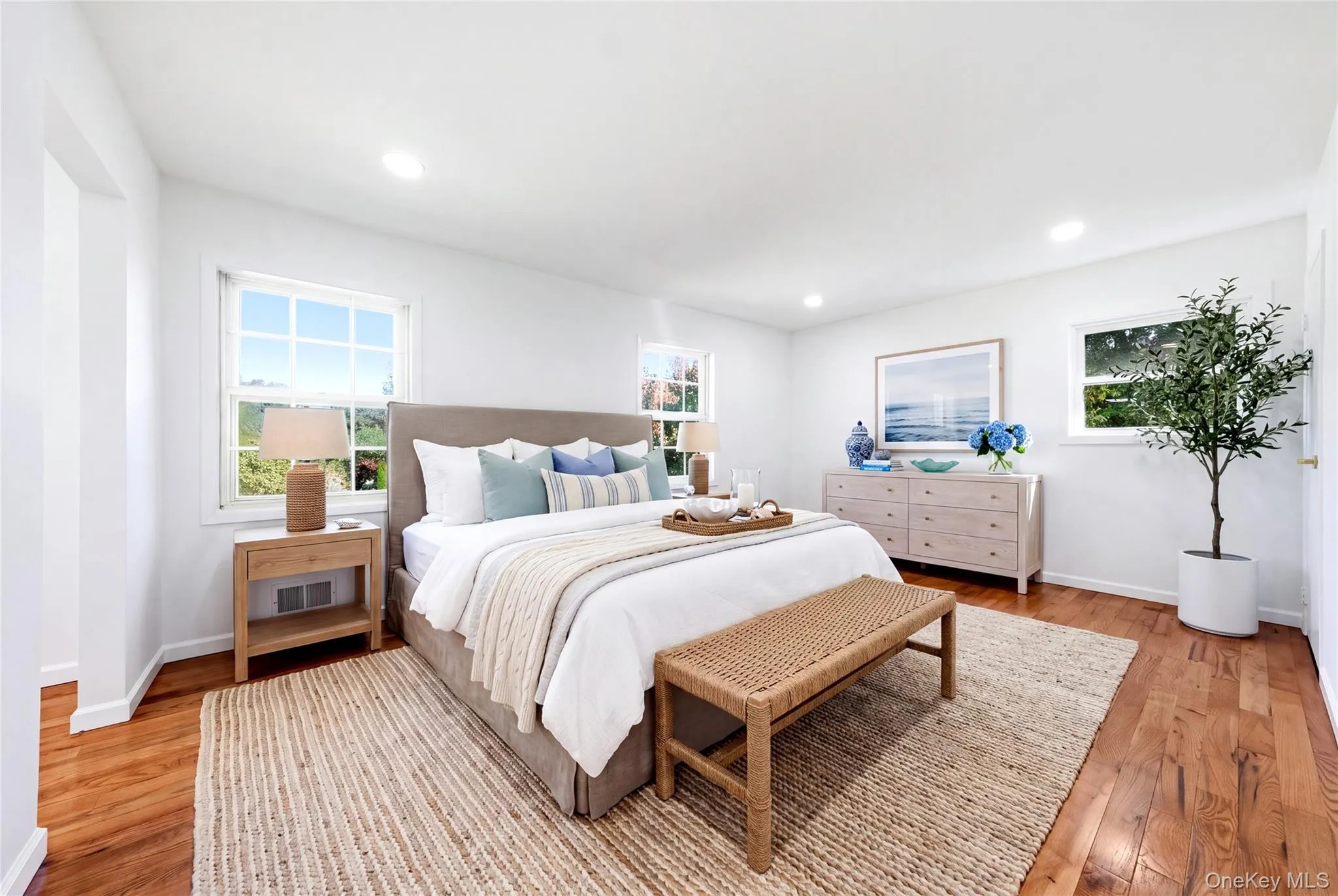 Virtually staged. Hardwood flooring, multiple windows, recessed lighting, and a neutral color palette Virtually staged. Hardwood flooring, multiple windows, recessed lighting, and a neutral color palette