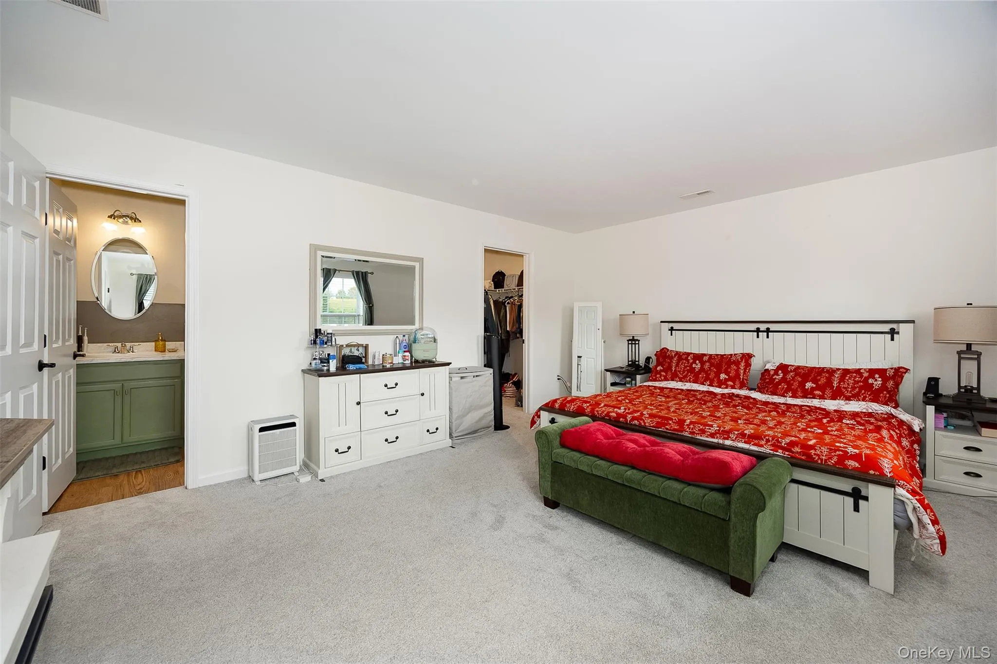 White paneled bed frame with dark hardware White paneled bed frame with dark hardware