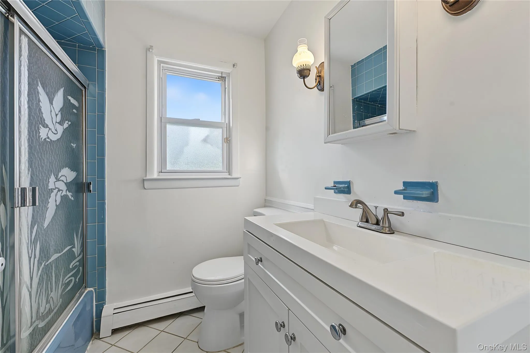First floor bathroom with updated Vanity with integrated sink, white cabinetry and tub/shower ombo First floor bathroom with updated Vanity with integrated sink, white cabinetry and tub/shower ombo