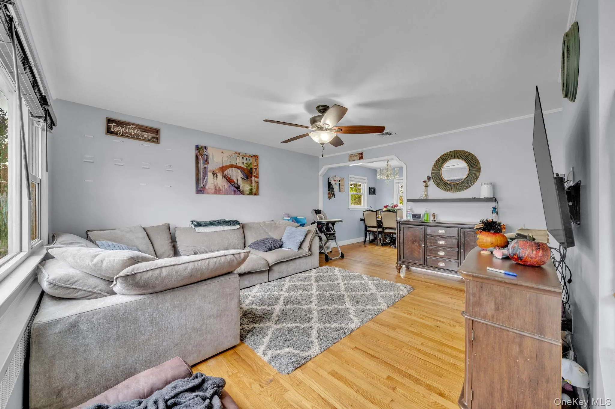 Hardwood flooring throughout, with a ceiling fan light fixture. Hardwood flooring throughout, with a ceiling fan light fixture.