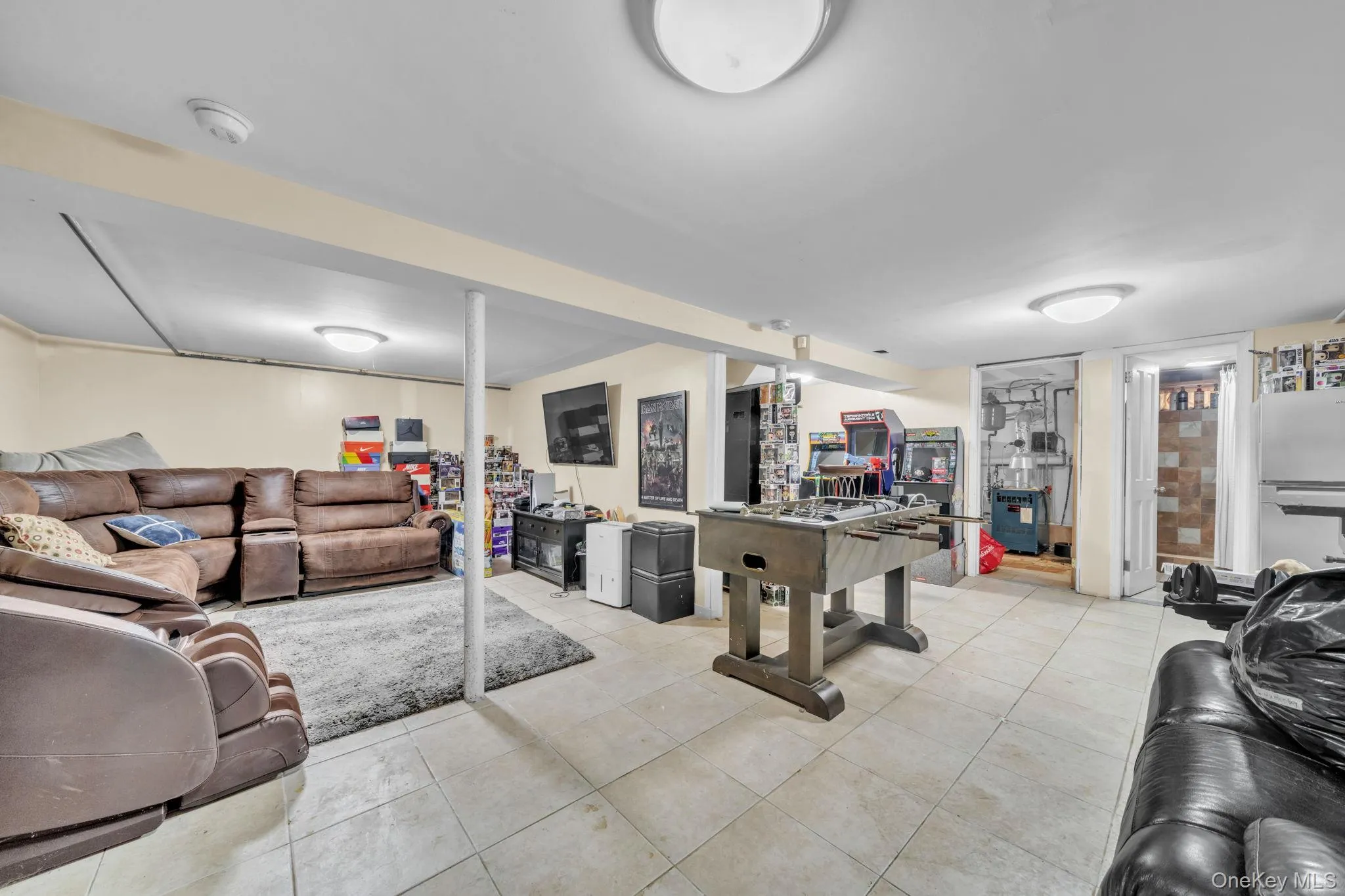 Expansive basement featuring tile flooring and recessed lighting Expansive basement featuring tile flooring and recessed lighting