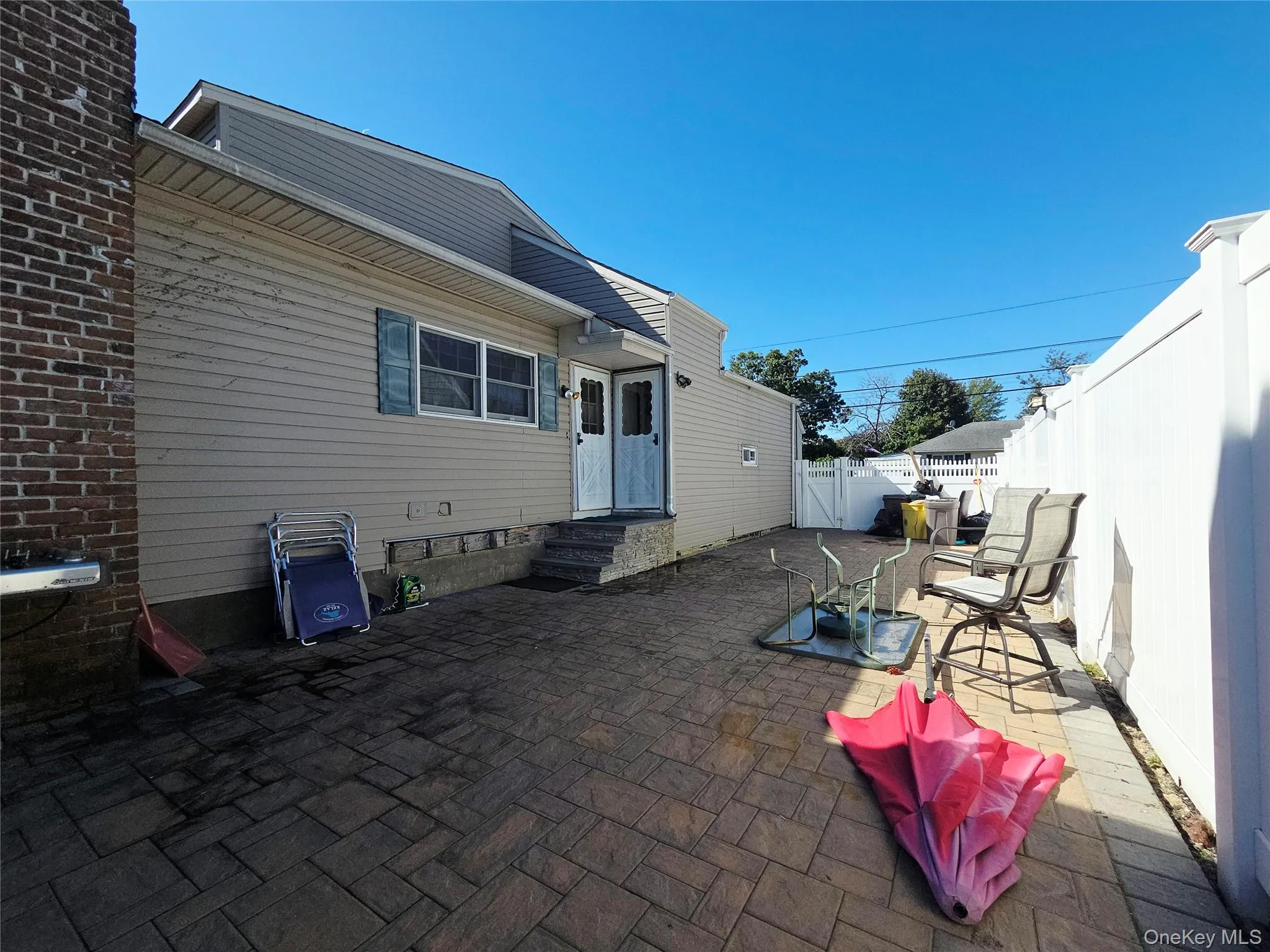 Back yard with main and second floor entry. Back yard with main and second floor entry.