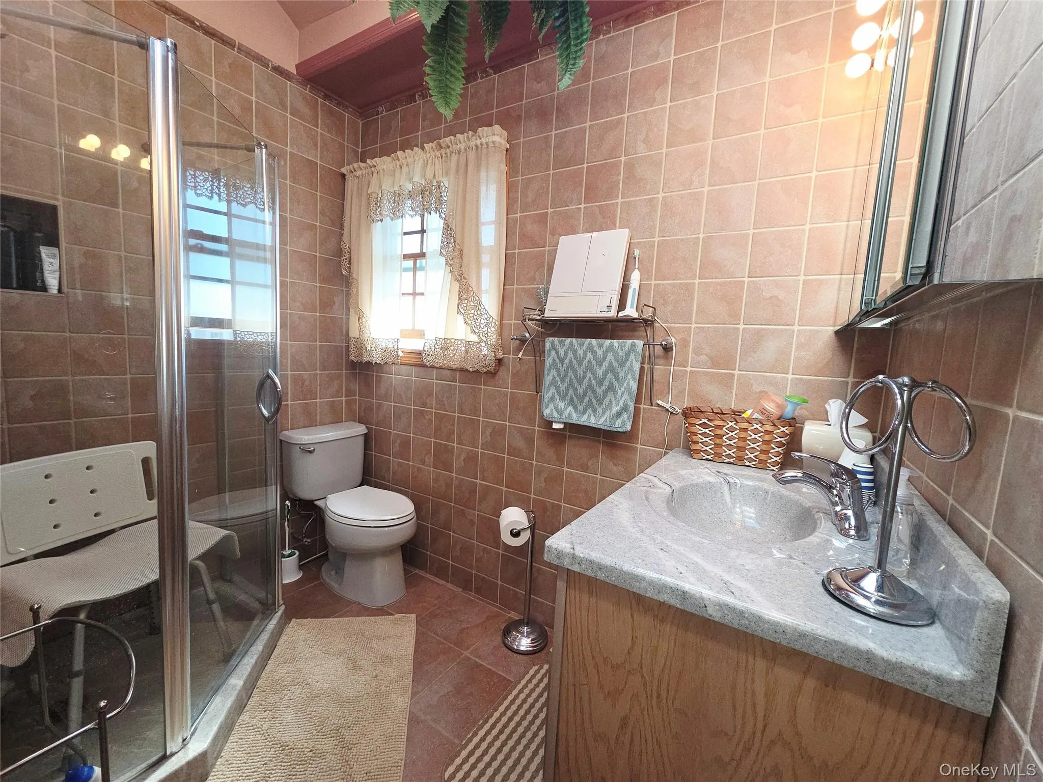 Nicely tiled full bathroom off living room Nicely tiled full bathroom off living room