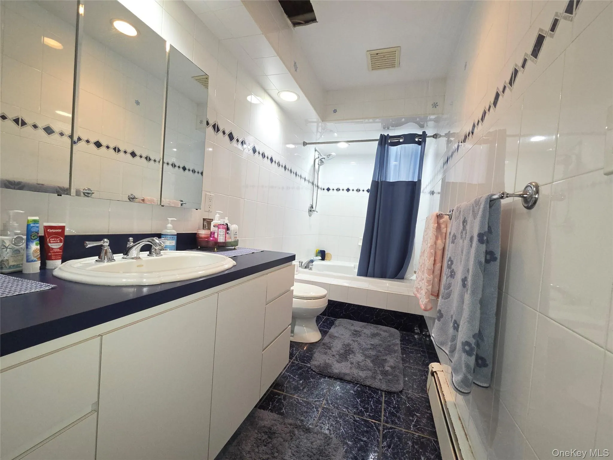 Hallway full bathroom. Large enough to put double sinks if desired. Hallway full bathroom. Large enough to put double sinks if desired.