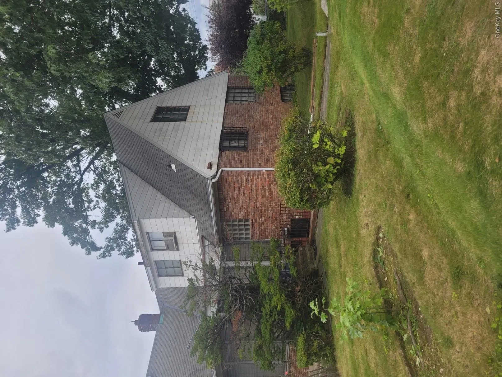 Brick and siding exterior with a pitched roof Brick and siding exterior with a pitched roof