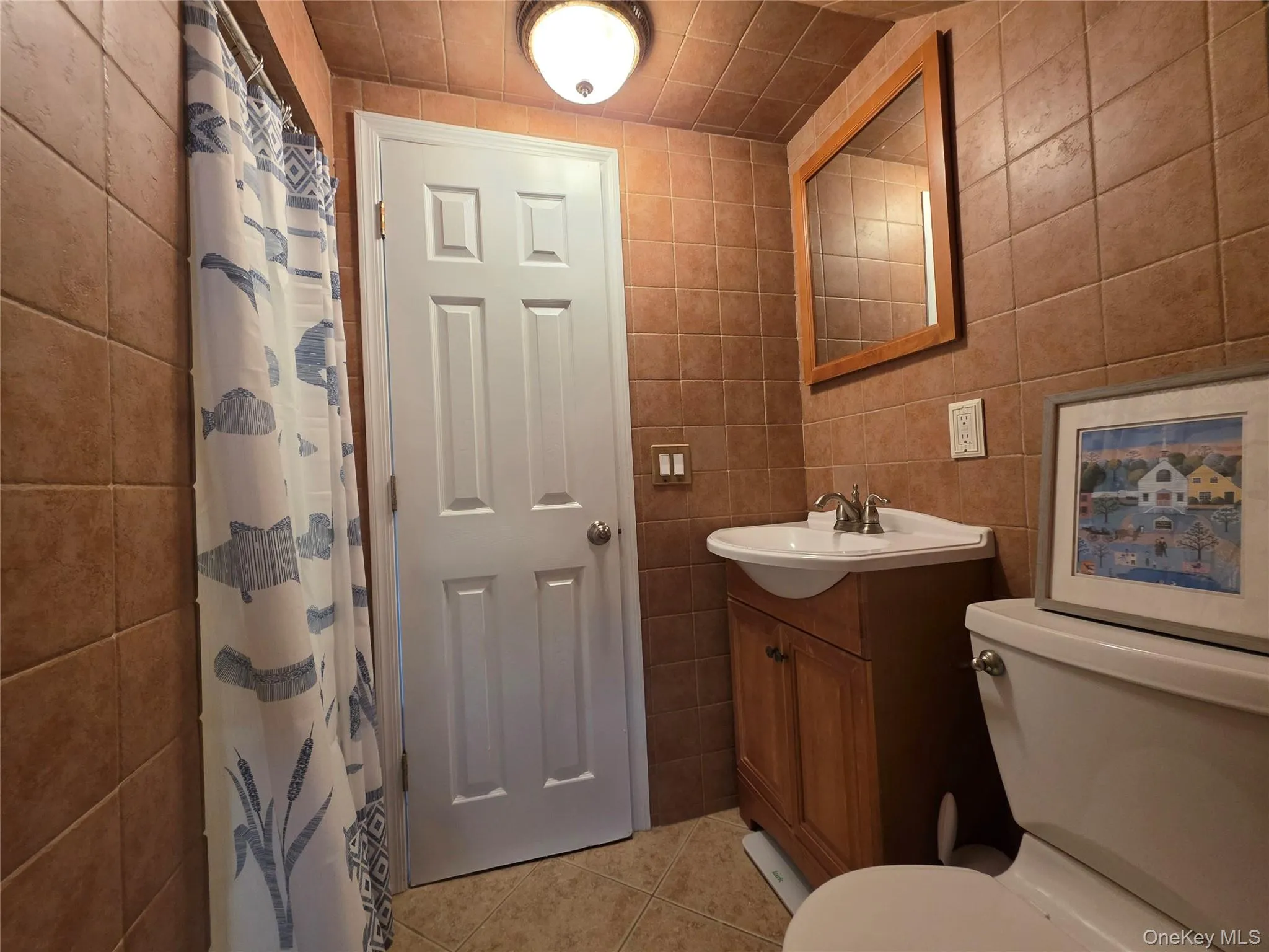 Second Floor Full Bath - Fully tiled with shower stall with a convenient linen closet in hallway Second Floor Full Bath - Fully tiled with shower stall with a convenient linen closet in hallway