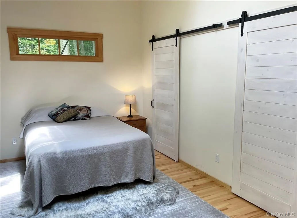 The bedroom with separate HVAC unit, featuring the full bath and wlk-in closet The bedroom with separate HVAC unit, featuring the full bath and wlk-in closet