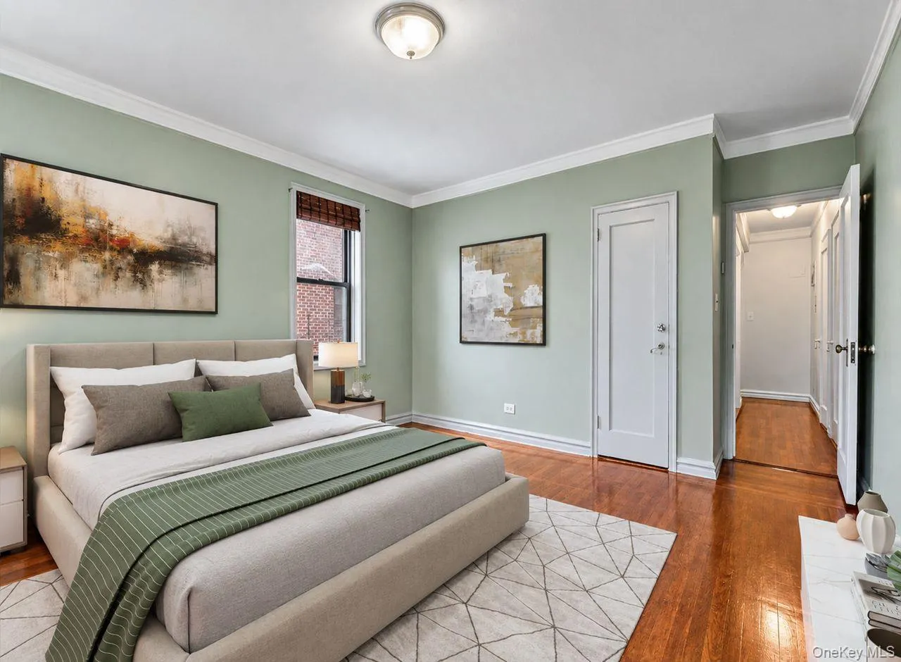 Hardwood flooring, painted walls, crown molding, cased window, and flush mount lighting Hardwood flooring, painted walls, crown molding, cased window, and flush mount lighting