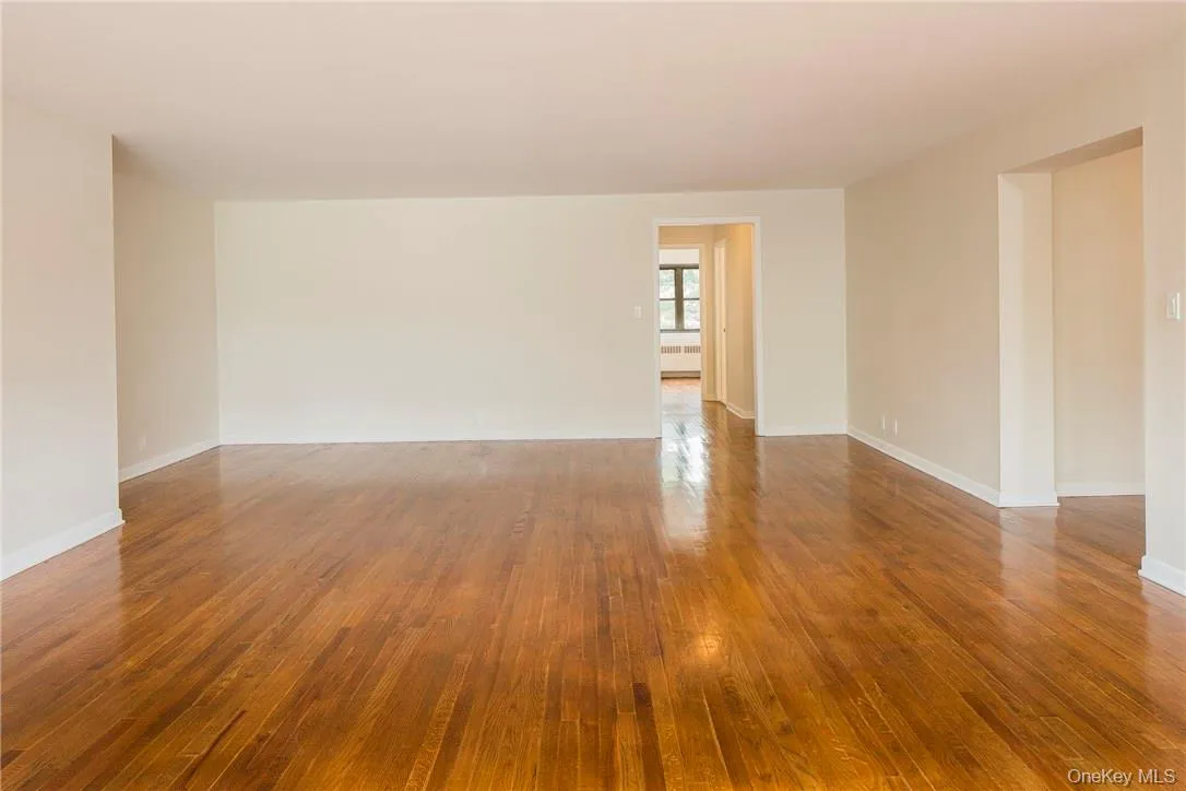 Living Room with hallway to bedroom area. Living Room with hallway to bedroom area.