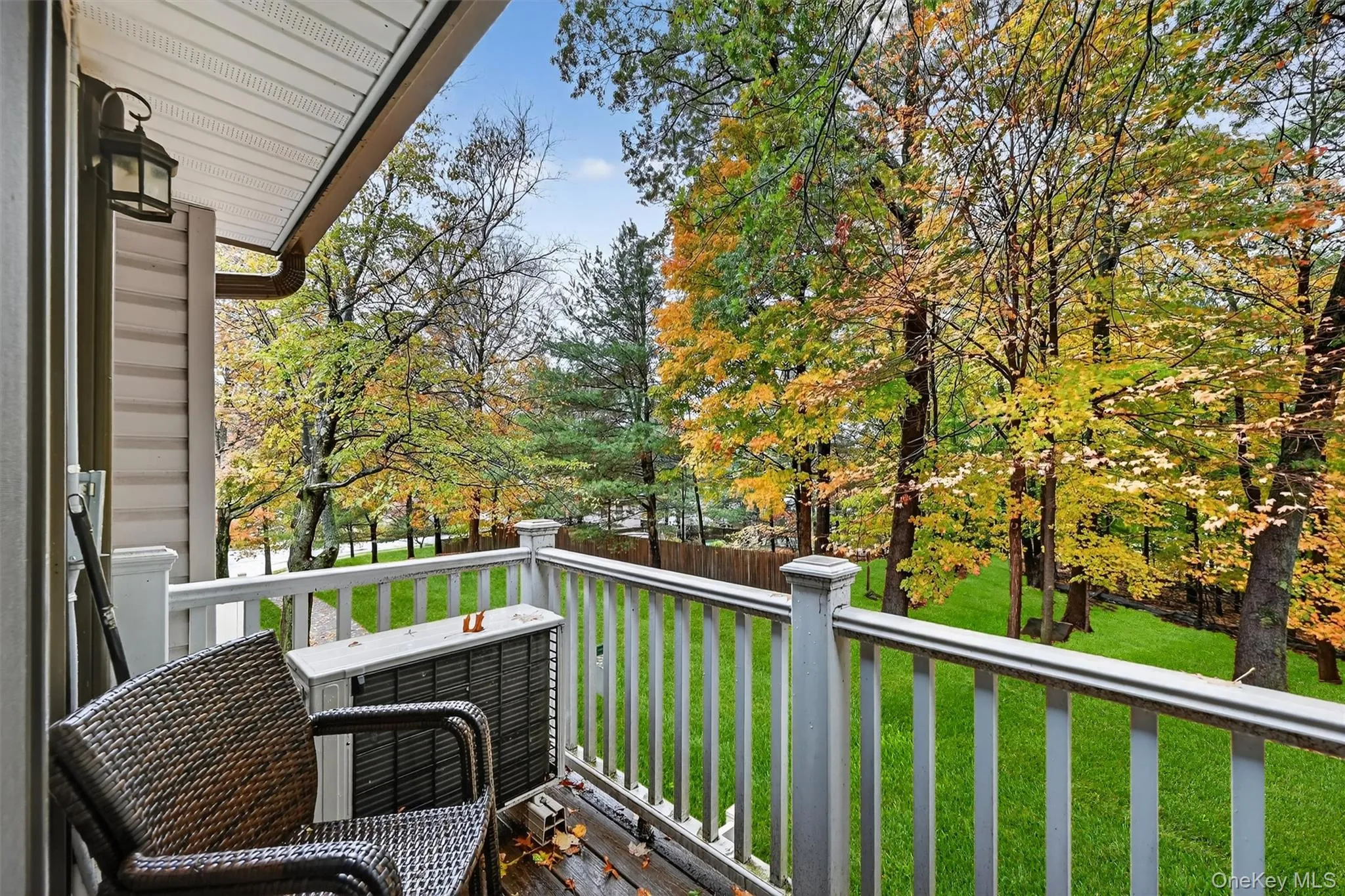 Balcony featuring view of scattered trees Balcony featuring view of scattered trees