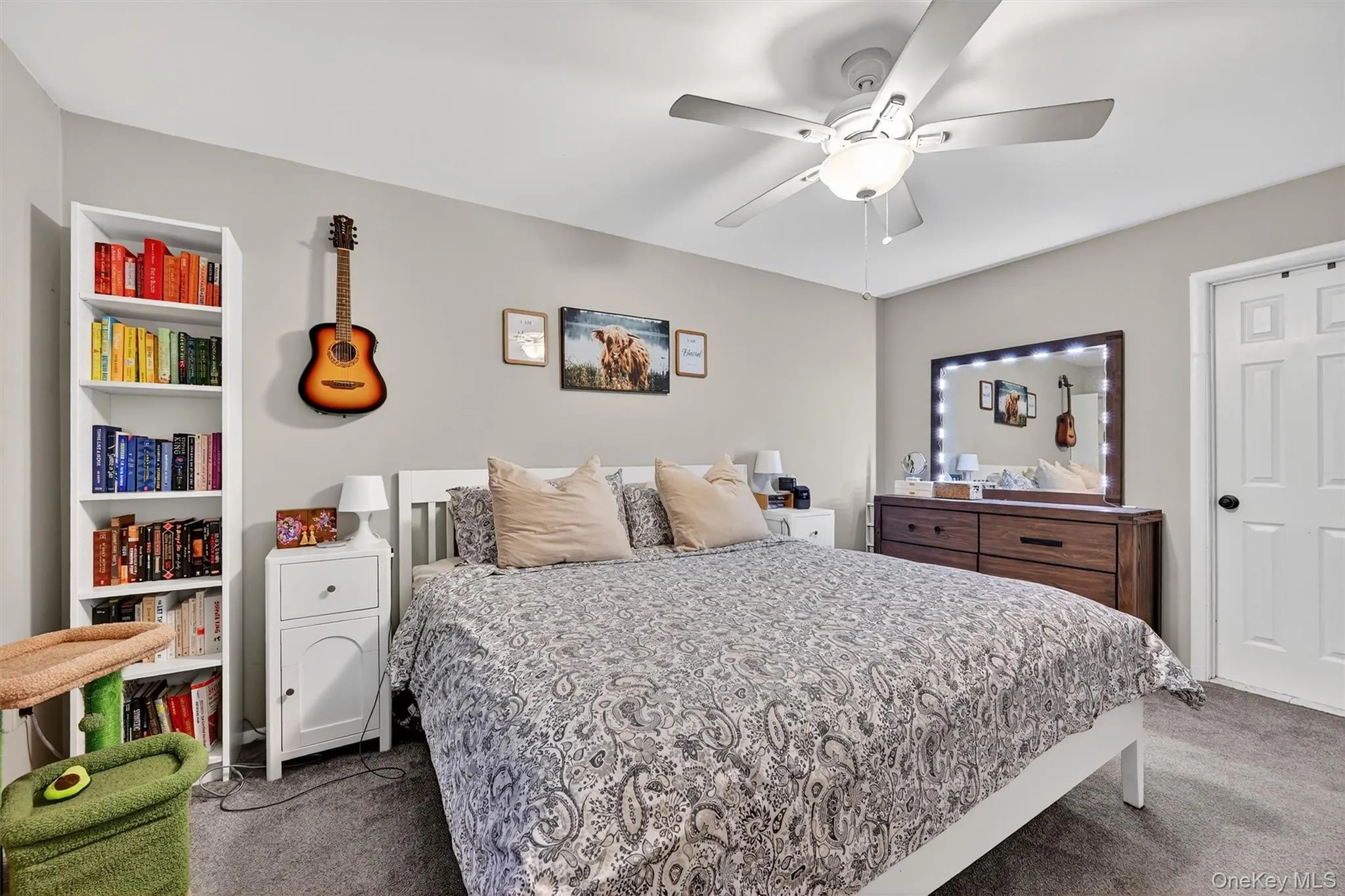 Bedroom with carpet and a ceiling fan Bedroom with carpet and a ceiling fan