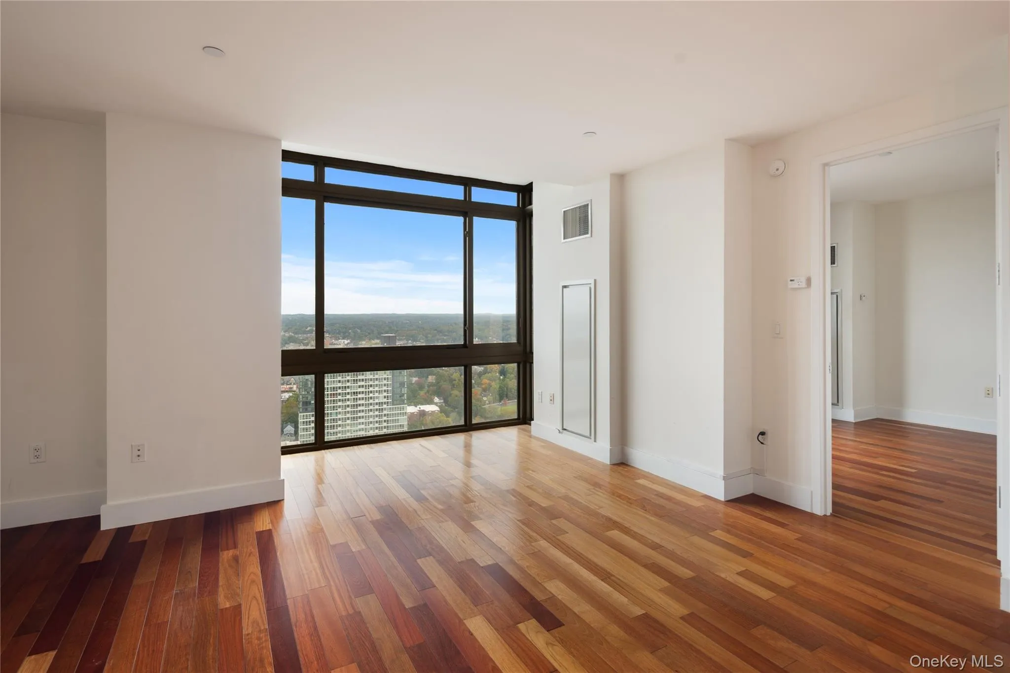 Floor to ceiling windows with skyline view Floor to ceiling windows with skyline view