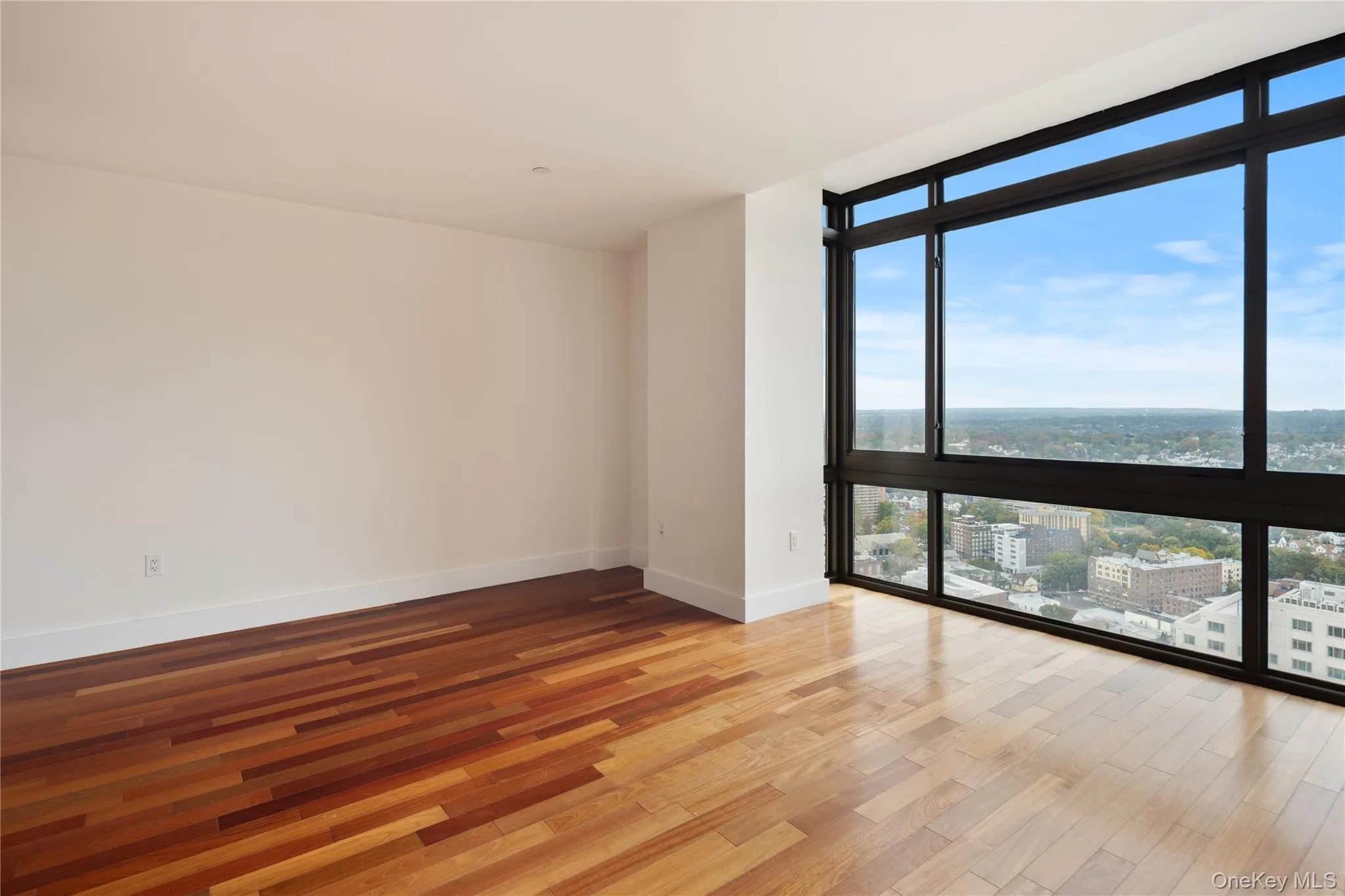 Floor to ceiling windows with skyline view Floor to ceiling windows with skyline view