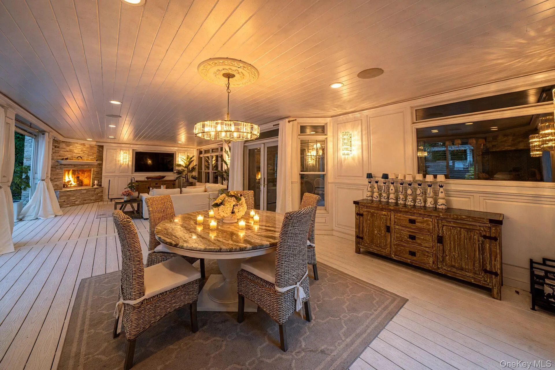 Shiplap ceiling with recessed lighting and a central chandelier Shiplap ceiling with recessed lighting and a central chandelier