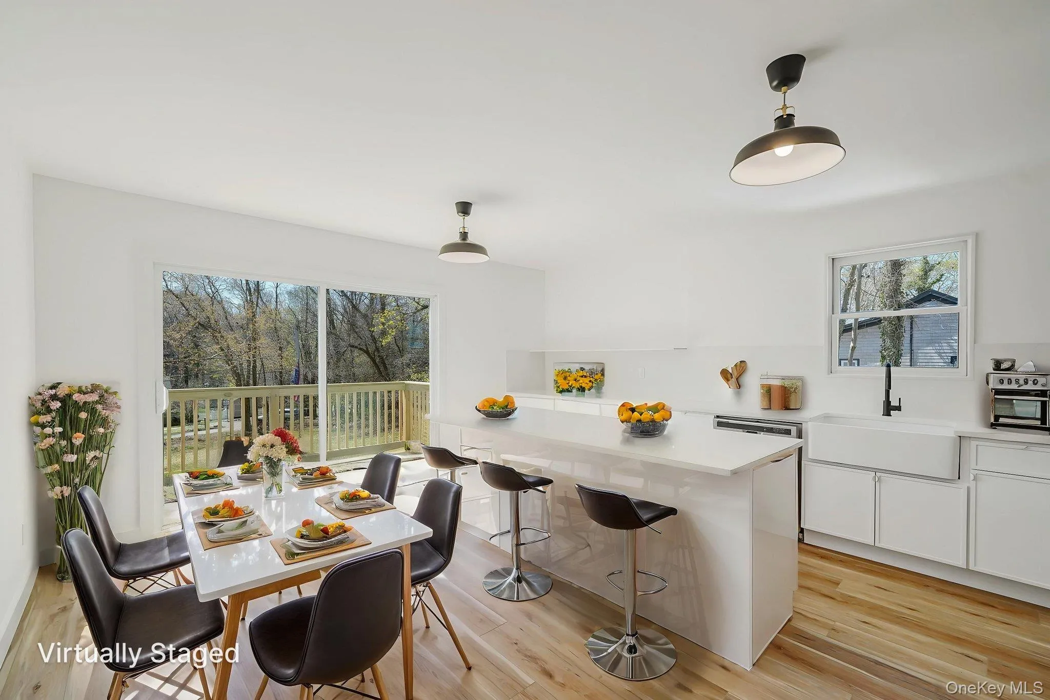 Dining space featuring healthy amount of natural light and light wood finished floors Dining space featuring healthy amount of natural light and light wood finished floors