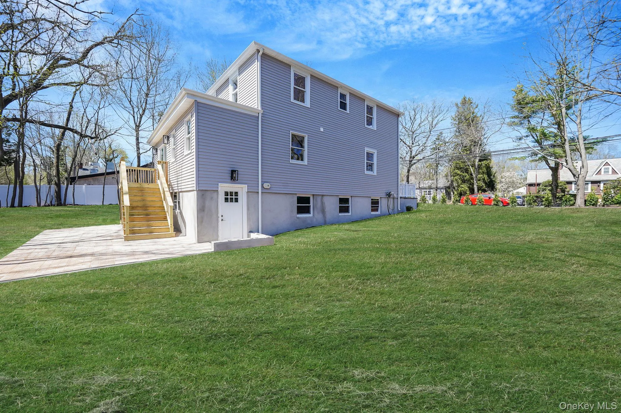 Back of property with stairway and a patio Back of property with stairway and a patio