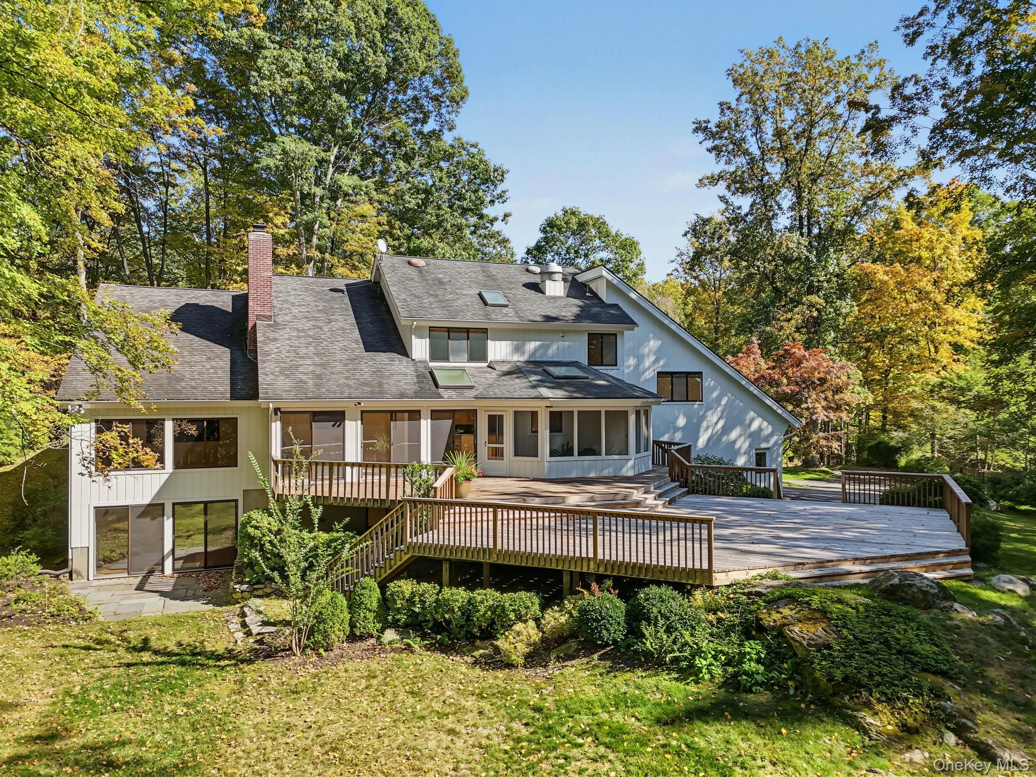 Expansive deck surrounded by nature, offering generous space for outdoor dining, entertaining, and relaxation. Expansive deck surrounded by nature, offering generous space for outdoor dining, entertaining, and relaxation.