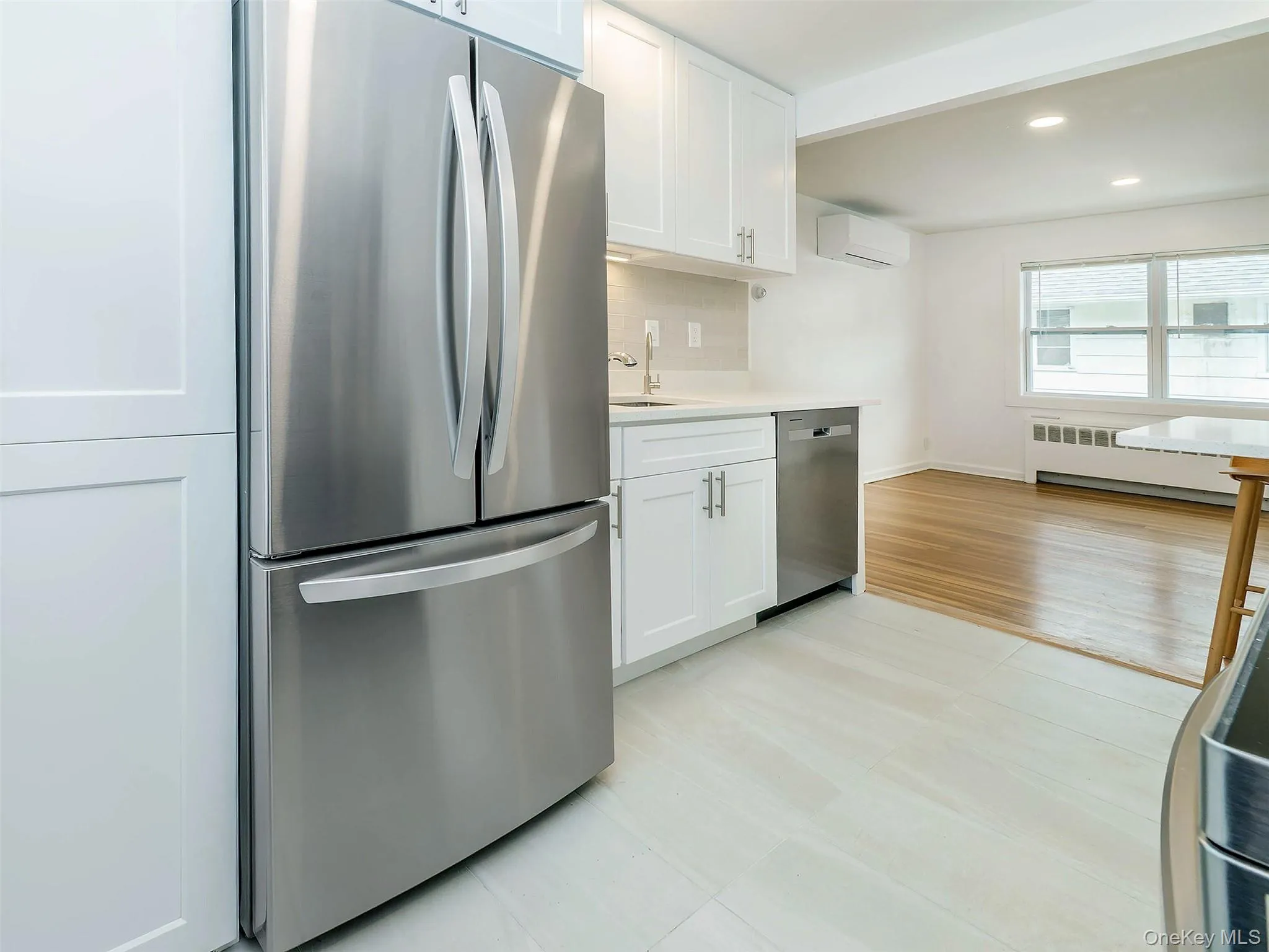 NEXT to the fridge...open the cabinet to the stackable WASHER & DRYER NEXT to the fridge...open the cabinet to the stackable WASHER & DRYER