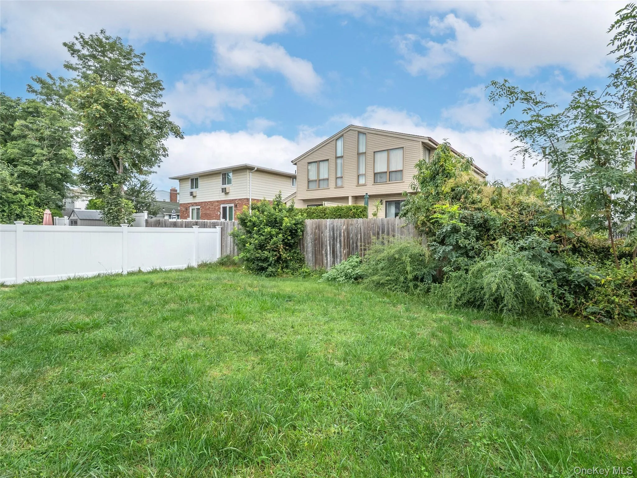 Back yard is private for Unit B. Lots of room to enjoy. Back yard is private for Unit B. Lots of room to enjoy.