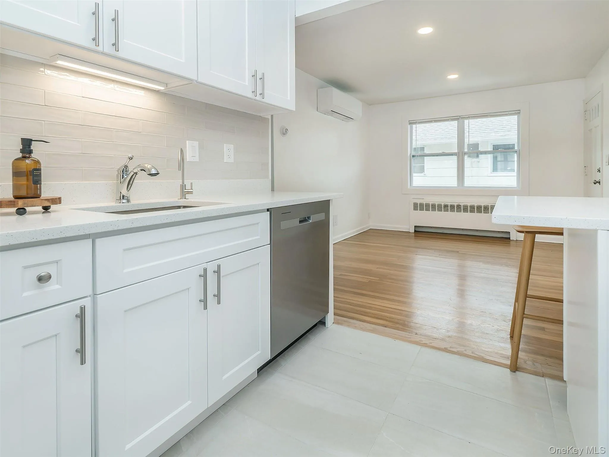 Under the counter light above sink with instant hot water. Under the counter light above sink with instant hot water.