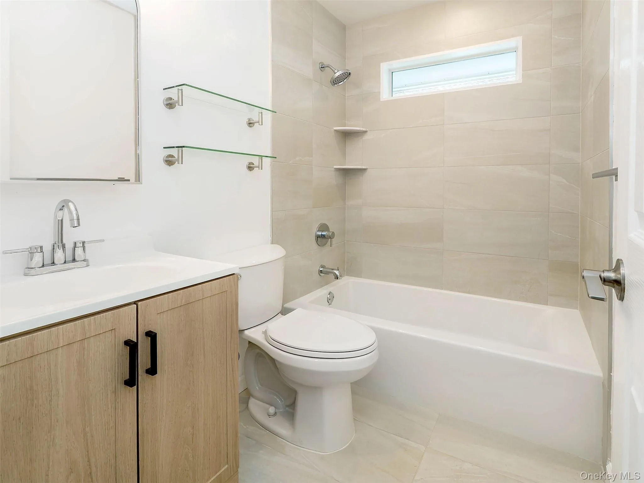 TOTALLY redone bathroom with shower/tub and beautiful appointed fixtures. TOTALLY redone bathroom with shower/tub and beautiful appointed fixtures.