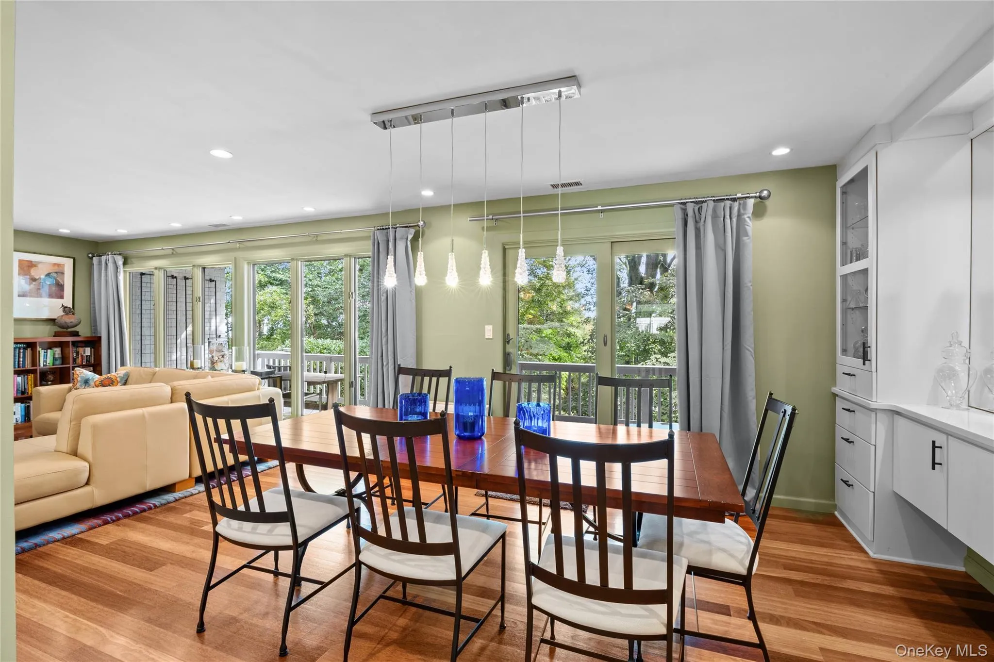 Dining room with custom built in buffet and sliding glass doors to expansive rear deck Dining room with custom built in buffet and sliding glass doors to expansive rear deck