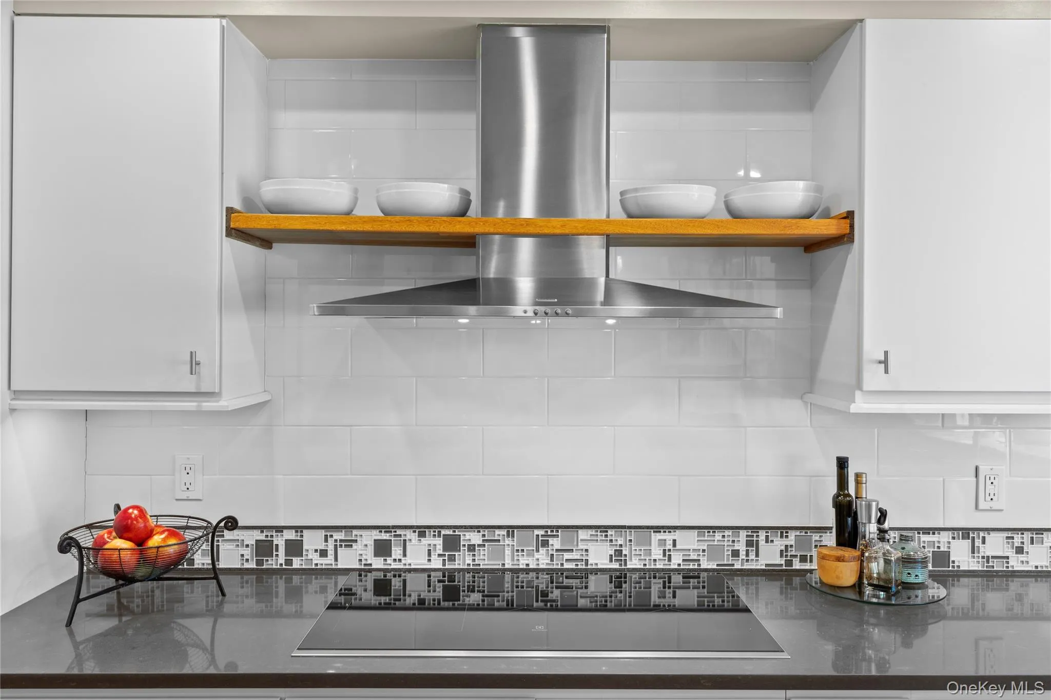 Furniture grade custom cabinetry with tile backsplash and every amenity Furniture grade custom cabinetry with tile backsplash and every amenity