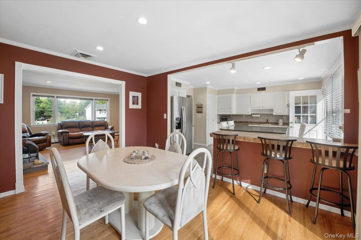 The dining room opens to the living room and kitchen, creating an easy flow for entertaining. The dining room opens to the living room and kitchen, creating an easy flow for entertaining.