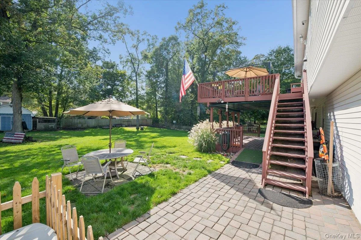 Paver patio off deck. Paver patio off deck.