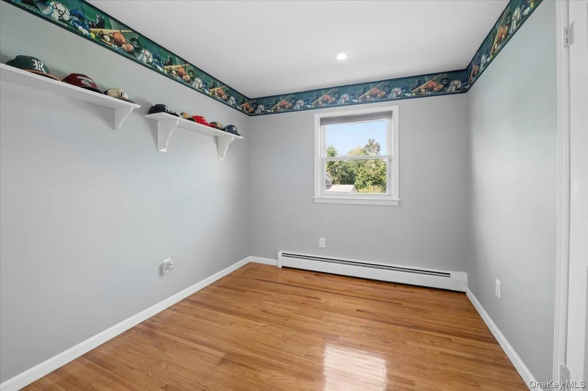 Third bedroom with hardwood floors and recessed lighting. Third bedroom with hardwood floors and recessed lighting.