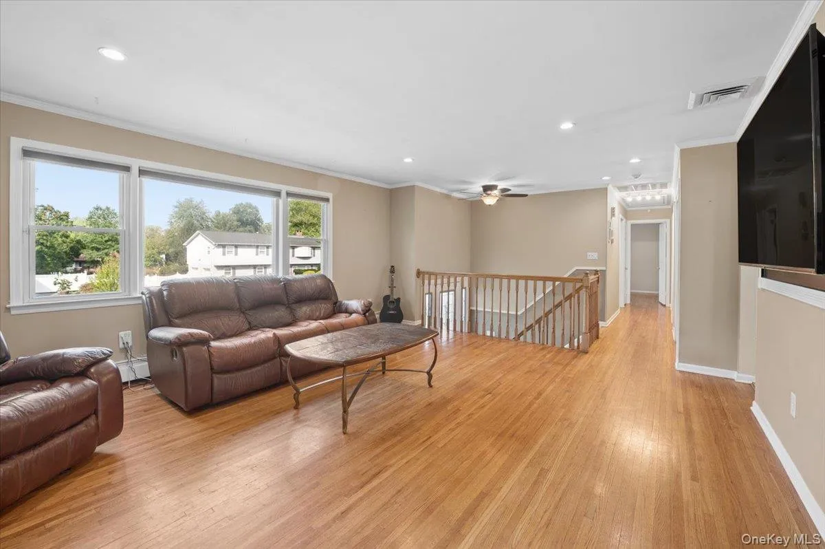 Formal living room with hardwood floors, recessed lighting, picture window and pellet stove. Formal living room with hardwood floors, recessed lighting, picture window and pellet stove.