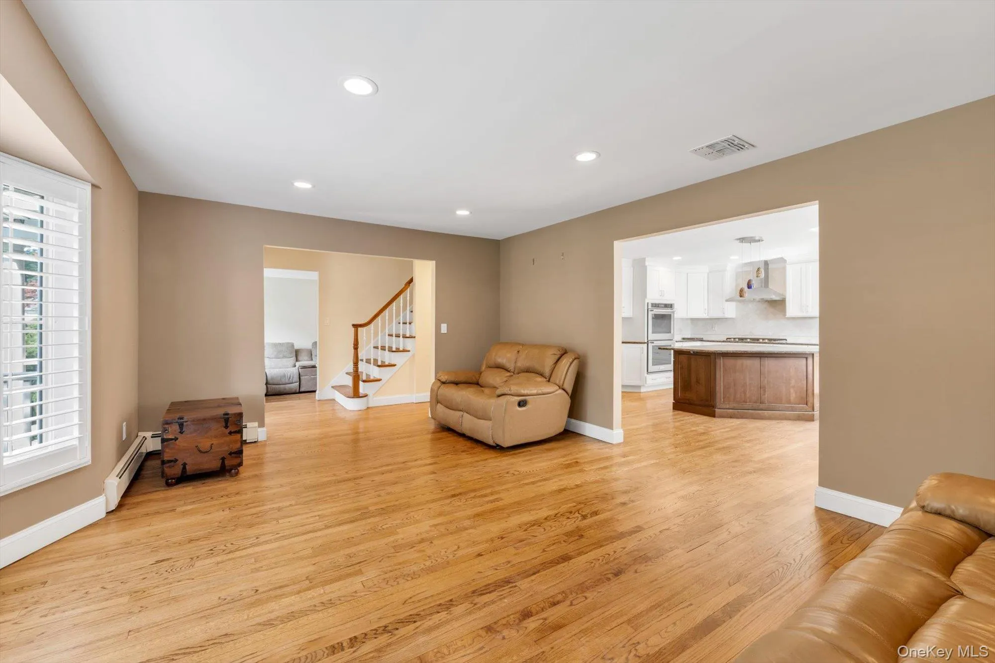 Entry to Upstairs and Living Room to Kitchen Entry to Upstairs and Living Room to Kitchen