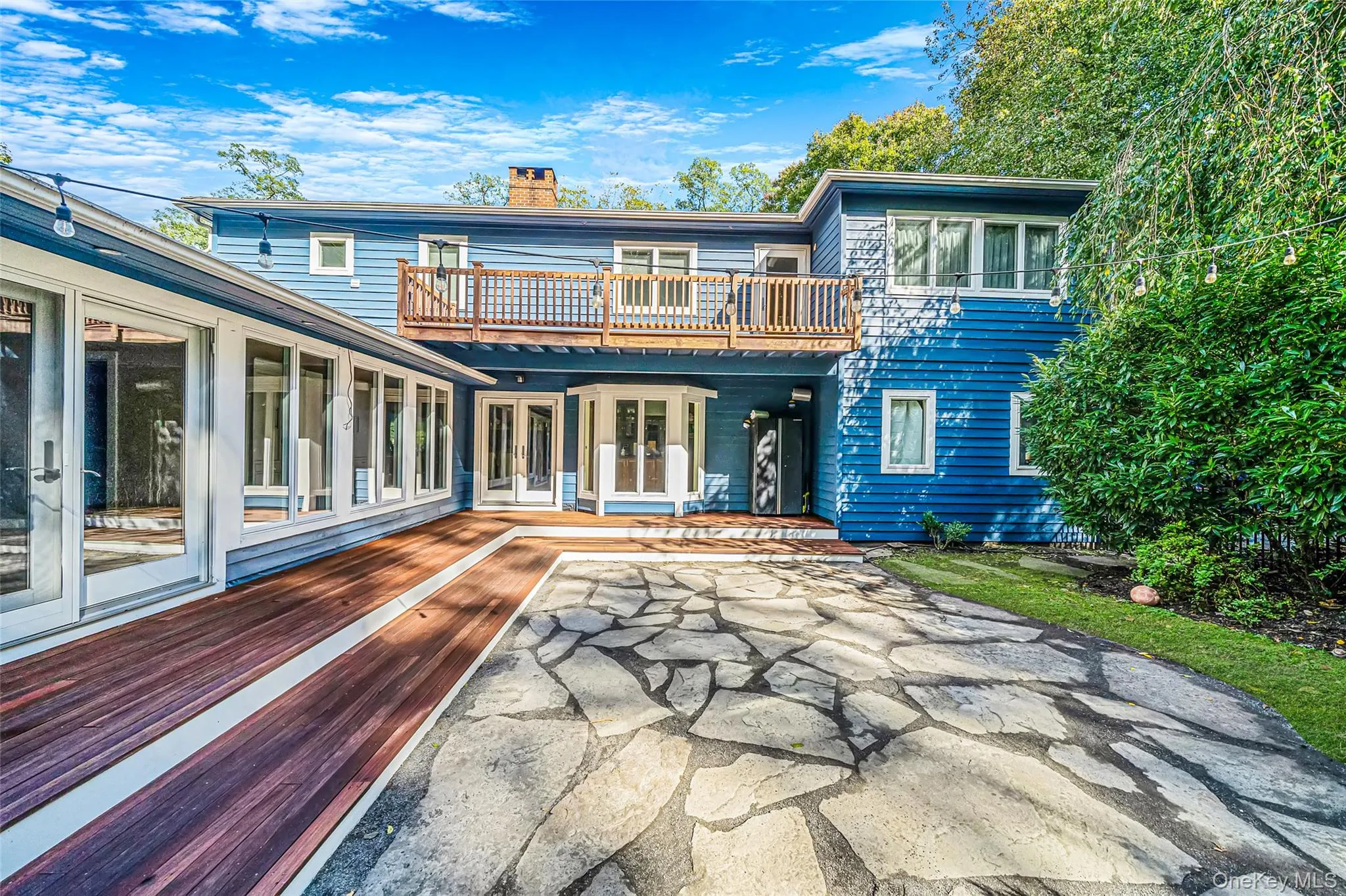 Courtyard patio with access from Dining Area and Family Room, mahogany decking and stone patio Courtyard patio with access from Dining Area and Family Room, mahogany decking and stone patio