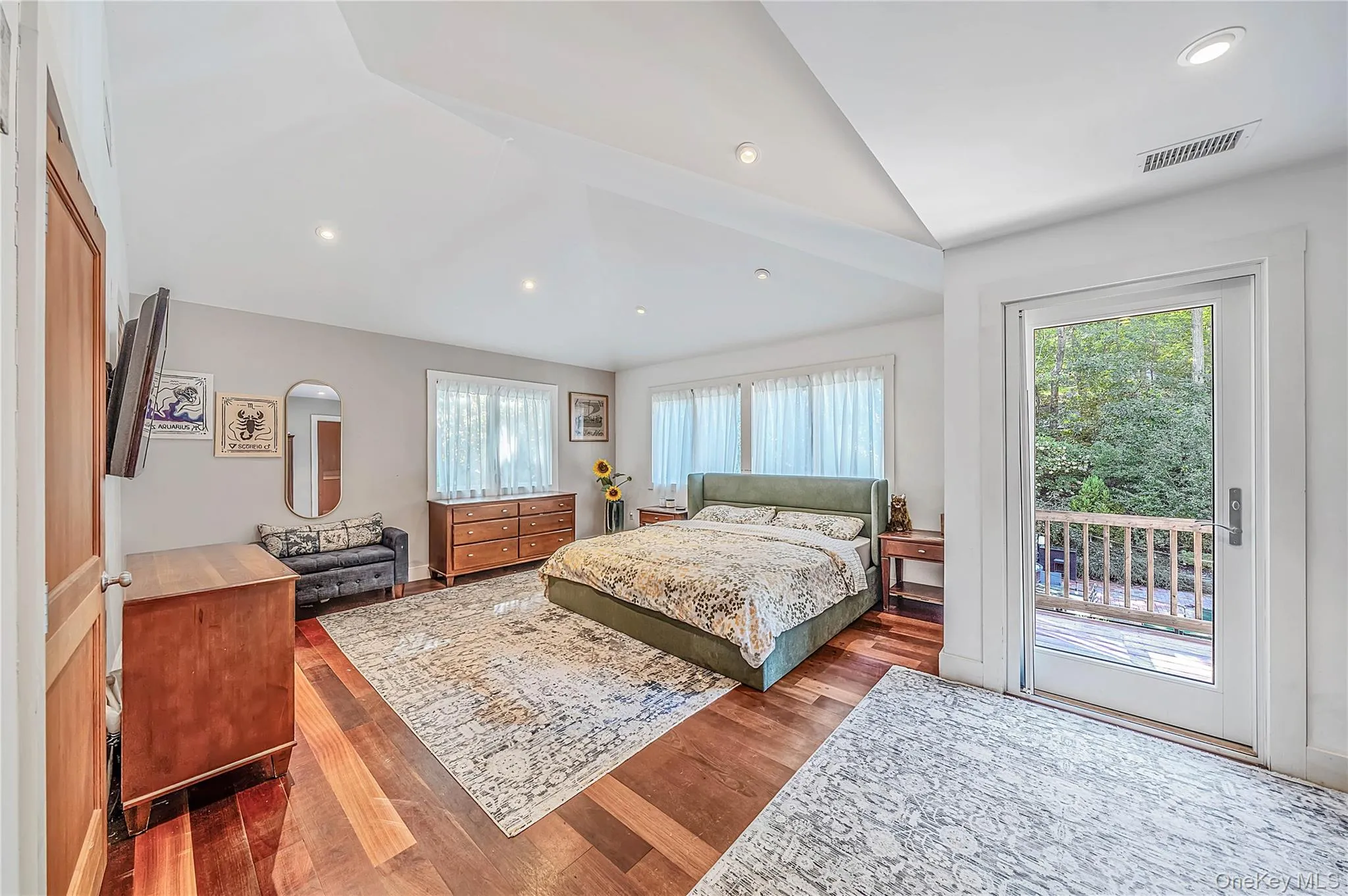 Retreat to the primary suite - wood floors, 2 walk in closets Retreat to the primary suite - wood floors, 2 walk in closets