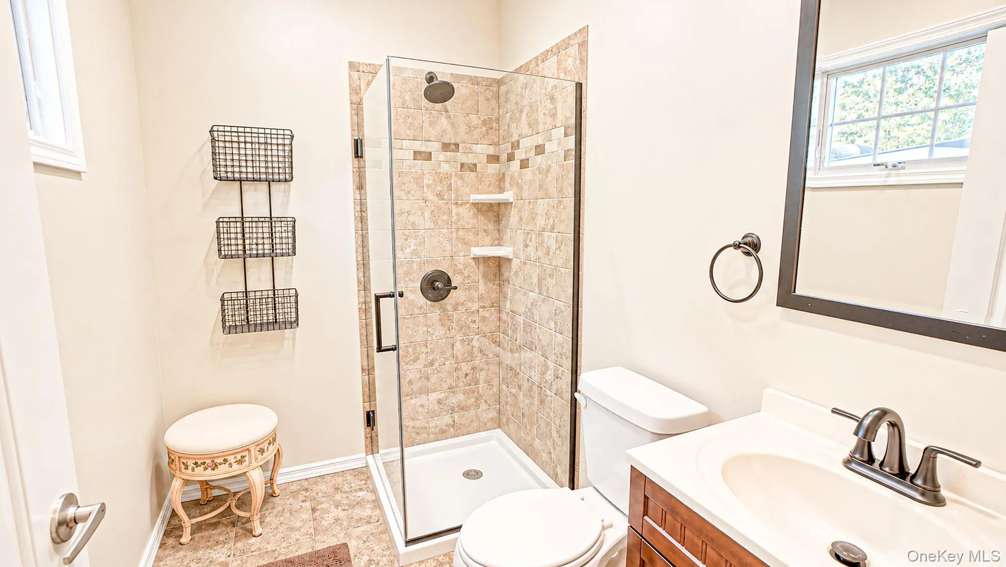 En Suite One - single sink vanity, glass shower tith detailed tile, radiant heated floor En Suite One - single sink vanity, glass shower tith detailed tile, radiant heated floor