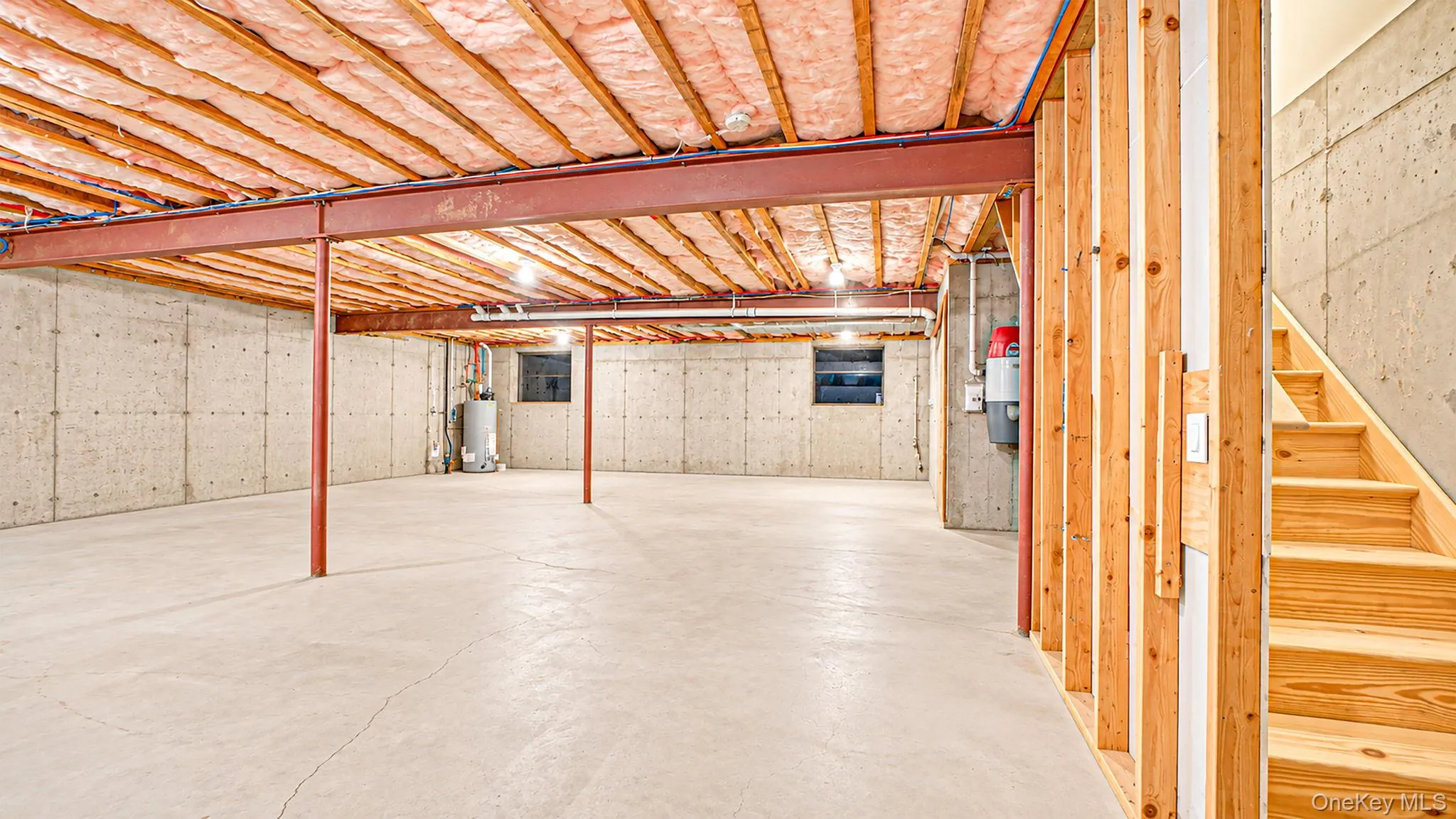 Expansive unfinished basement featuring exterior entrance, utilities and crawl space Expansive unfinished basement featuring exterior entrance, utilities and crawl space