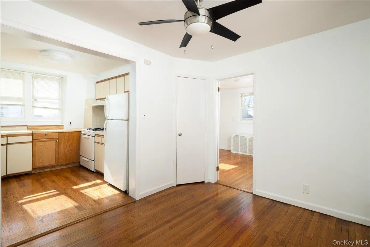 Second Floor Dining Room featuring wood-finish flooring, a ceiling fan with integrated lighting, and natural light from multi-pane windows Second Floor Dining Room featuring wood-finish flooring, a ceiling fan with integrated lighting, and natural light from multi-pane windows